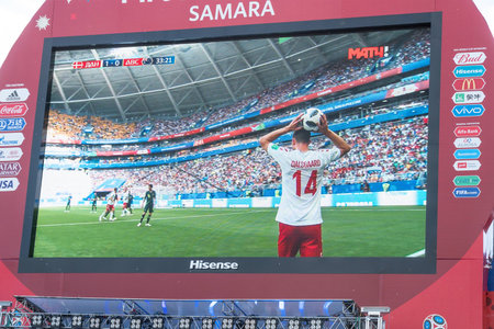 SAMARA, RUSSIA - JUNE 21, 2018: Broadcast of the match Denmark-Australia on the screen in the fan zone of the world Cup 2018 in Samara on Kuibyshev squareのeditorial素材