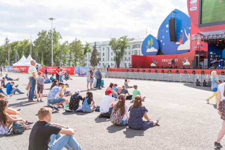 SAMARA, RUSSIA - JUNE 21, 2018: Football fans watch live broadcast of match in fan zone of 2018 FIFA world Cup in Samaraのeditorial素材
