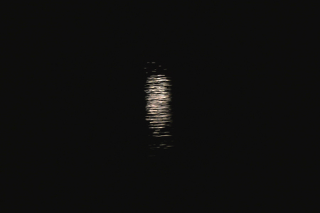 Moon path on the water at night. Reflection of the moonlight on the water. Dark Keyの写真素材