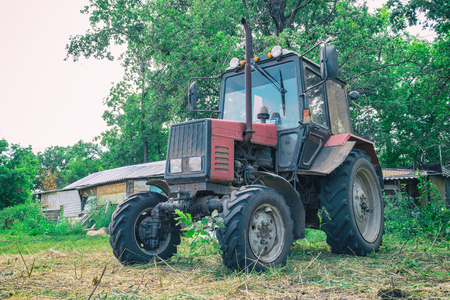 Tractor for working in the field and mowing grass. Agricultural machineryの写真素材