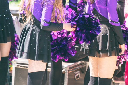 Cheerleaders in purple suits with a Pom-Pomsの写真素材