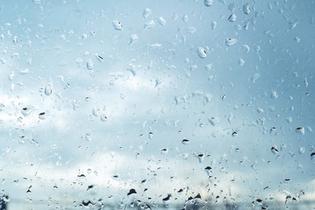 Water drops on glass for background and designの写真素材