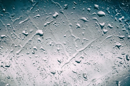 Water drops on glass for background and designの写真素材
