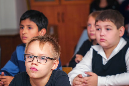 CHAPAEVSK, SAMARA REGION, RUSSIA - OCTOBER 24, 2018: School kids in the classroom sitting at their...