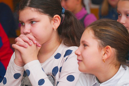 CHAPAEVSK, SAMARA REGION, RUSSIA - OCTOBER 24, 2018: Two girls in the classroom at the Desk listening to the teacherのeditorial素材