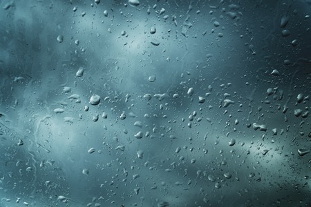 Water drops on glass for background and designの写真素材