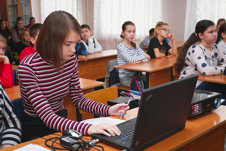 CHAPAEVSK, SAMARA REGION, RUSSIA - OCTOBER 24, 2018: Girl in class sitting at the laptopのeditorial素材