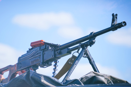 Russian machine gun on the background of the cloudy sky