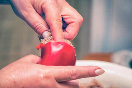 Stuffed with minced meat bell pepper. Stuffing peppers. Cooking food. Selective focusの写真素材