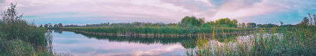 Panorama Evening or sunrise on a quiet forest lake in summer