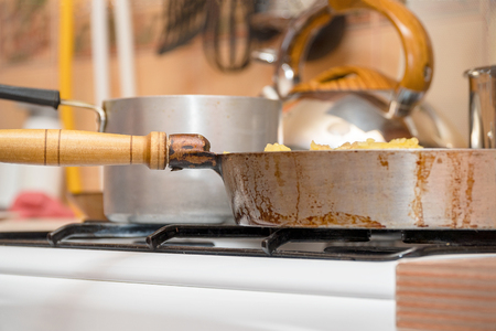 Pan on the gas stove close-up. Kitchen utensils. Selective focusの写真素材