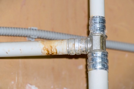 Sanitary engineering. Connection of plastic pipes through tees fittingsの写真素材