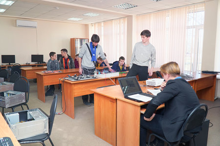 Chapaevsk, Samara region, Russia - April 17, 2019: Students connect wires control panel with a small test bench for experimentsのeditorial素材