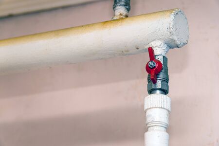 Tap on the water pipe. Selective focus