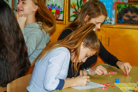 Chapaevsk, Samara region, Russia - April 16, 2019: College in Chapaevsk city. Students in a lesson create crafts from paperのeditorial素材