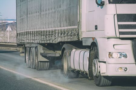 Big Truck rides on the road. Truck transportation