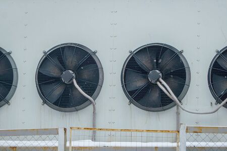 Industrial air conditioning system. Large fans on the wall of the buildingの写真素材