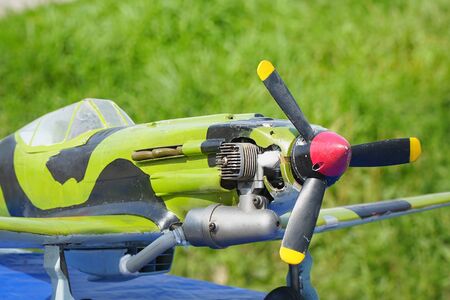 The model airplane is handcrafted with a propeller on radio control