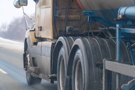 Truck wheels on the road in motionの写真素材