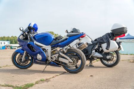 Modern Road bike is blue with the helmet on the handlebarsの写真素材