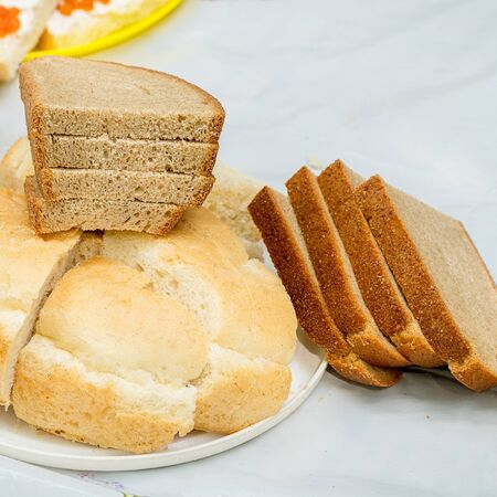 Rye and wheat bread sliced for breakfast in a plate