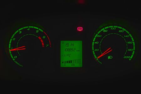 Speedometer in the car on the dashboard at night. Selective focus
