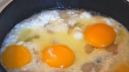 Eggs are fried in a pan. Cooking fried eggの写真素材