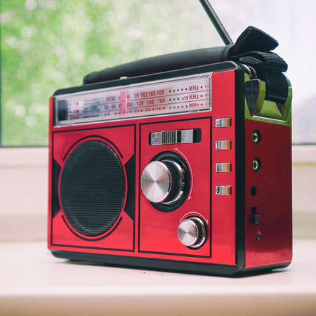 Old radio receiver with analog tuning scaleの写真素材