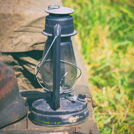 Old kerosene oil lamp on a natural background. Selective focusの写真素材