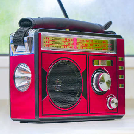 Old radio receiver with analog tuning scaleの写真素材