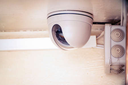 Security camera on the light ceiling in officeの写真素材