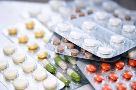 Overall view of pharmaceutical tablets and capsules in packages in assortmentの写真素材