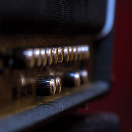 Knobs for volume, tone and various settings on the guitar ampの写真素材