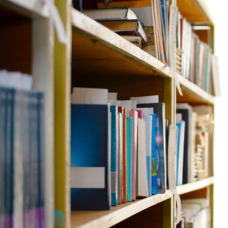 Books on a shelf in the library. Selective focusの写真素材