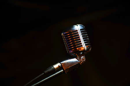 Shiny retro microphone on a black background. Soft focusの写真素材