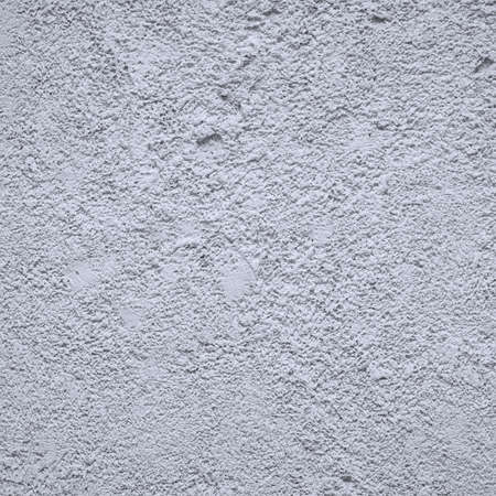 The wall is covered with gray decorative plasterの写真素材