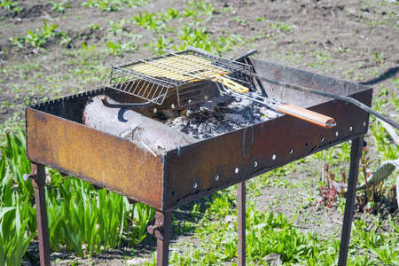 Brazier and metal grill for cooking barbecueの写真素材