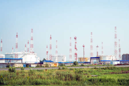 Oil depot on the background of the sky with a lot of lightning rodsの写真素材