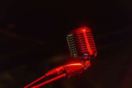 Shiny retro microphone on a black background. Soft focusの写真素材