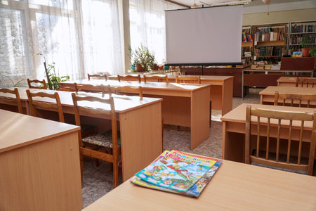 Chapaevsk, Samara region, Russia - January 24, 2020: An empty school classroom with a white screenのeditorial素材