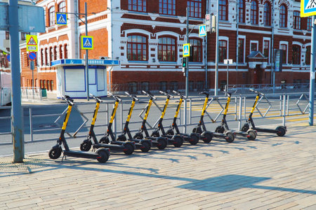 Samara, Russia - circa August, 2021: Vacant electric scooters are on the street of the cityのeditorial素材