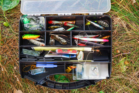 Spinners, wobblers, various fishing tackle in a boxの写真素材