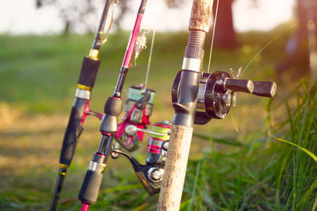 Spinning rods with reels and lures ready for fishing