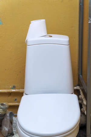 Toilet paper on the toilet tankの写真素材