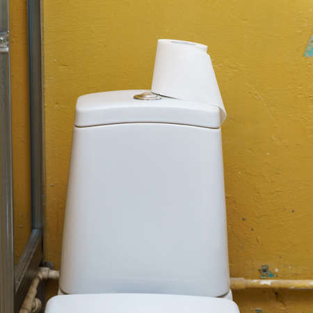 Toilet paper on the toilet tankの写真素材