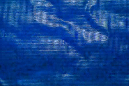 Blue banner background made of PVC plastic for design. Selective focusの写真素材
