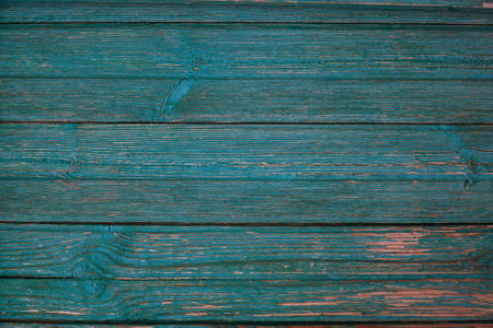 Texture of Old cracked aquamarine or celadon boards for background and design. The texture of dry wood planksの写真素材