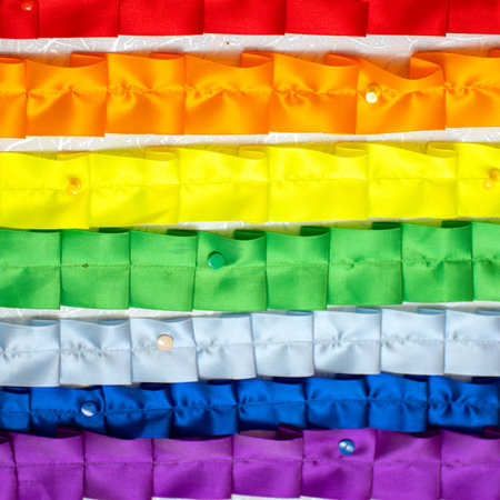 Rainbow of folded nailed or pinned ribbonsの写真素材