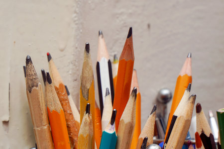 Different pencils in a jar on the table. Selective focusの写真素材