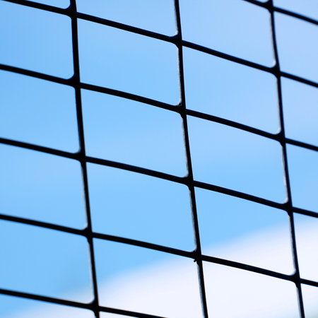 Grid with a rectangular cell on a blue sky backgroundの写真素材